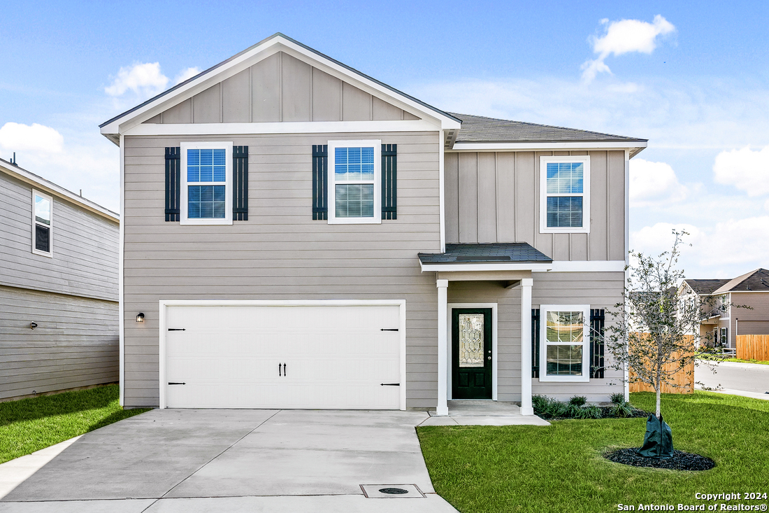 front view of a house with a yard