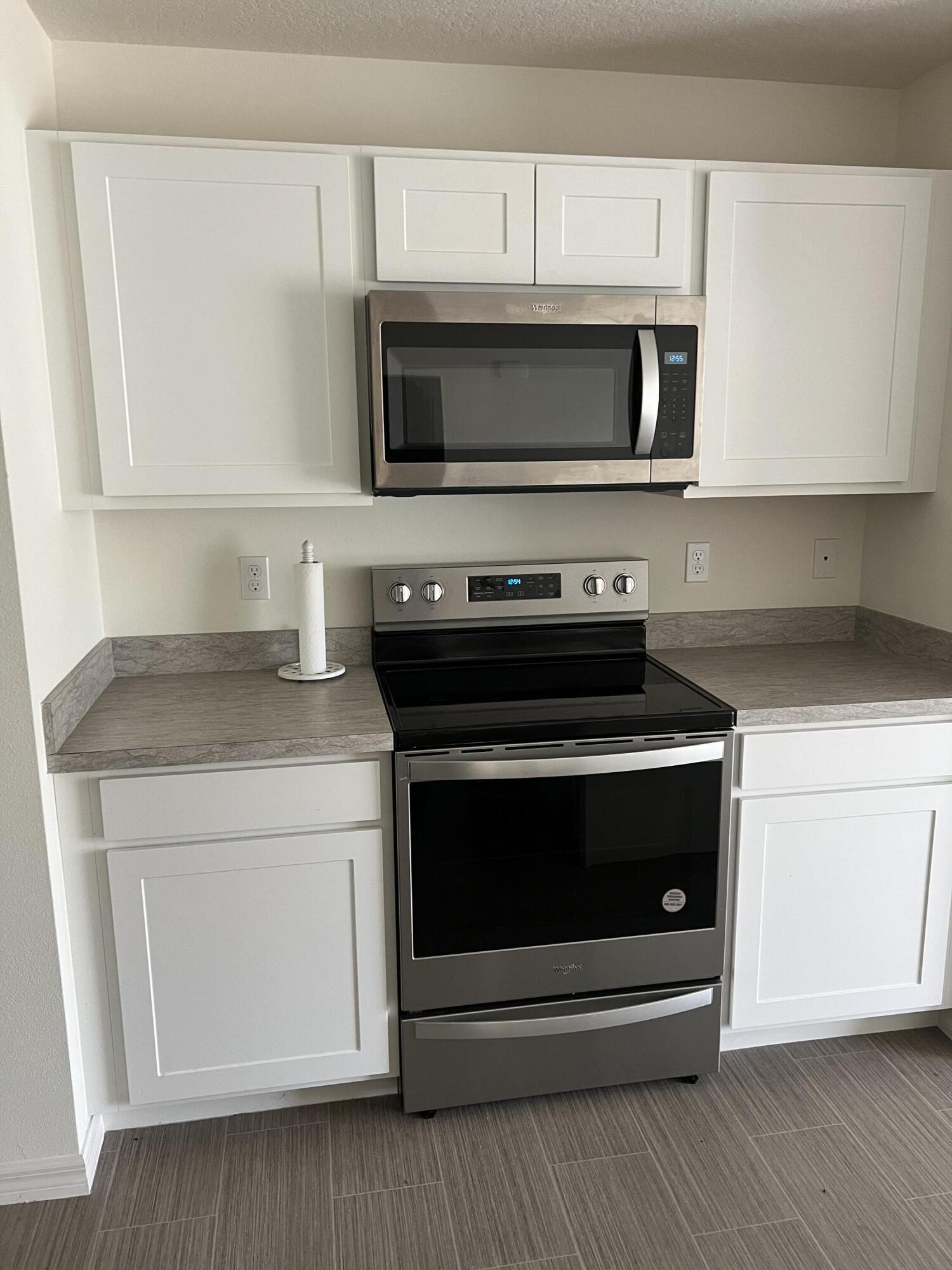 a kitchen with a stove and a microwave