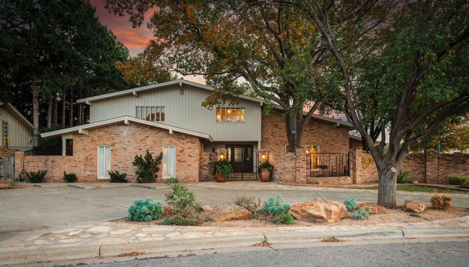 a house with a tree in front of it