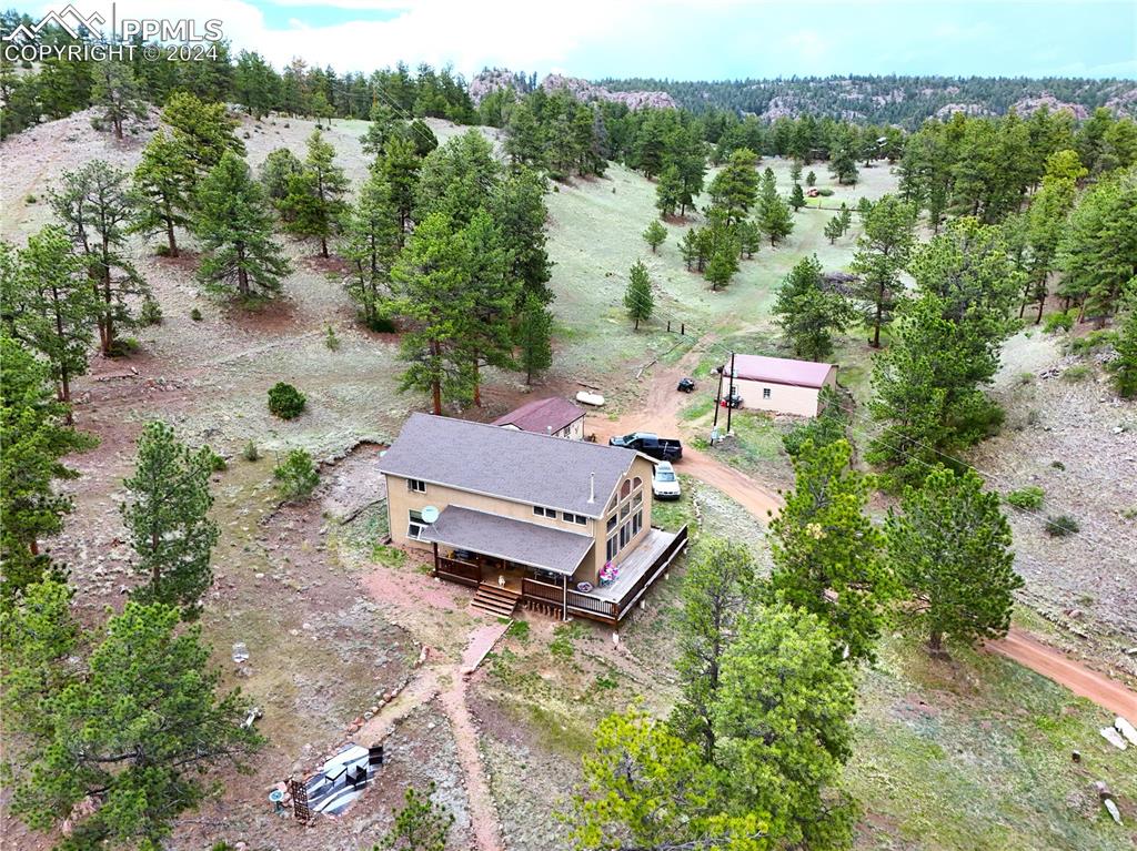 an aerial view of a house with mountain view