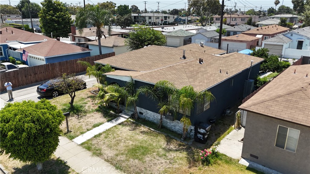 an aerial view of a house with garden space and sitting space