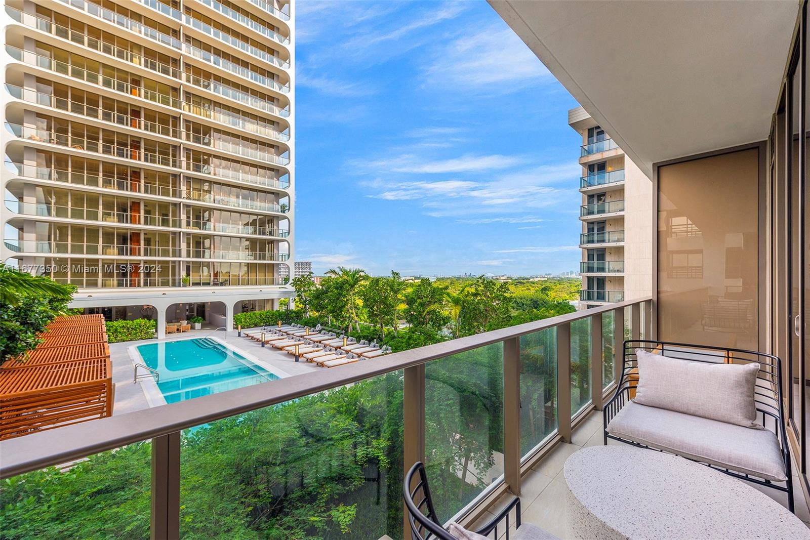 a balcony view with a seating space