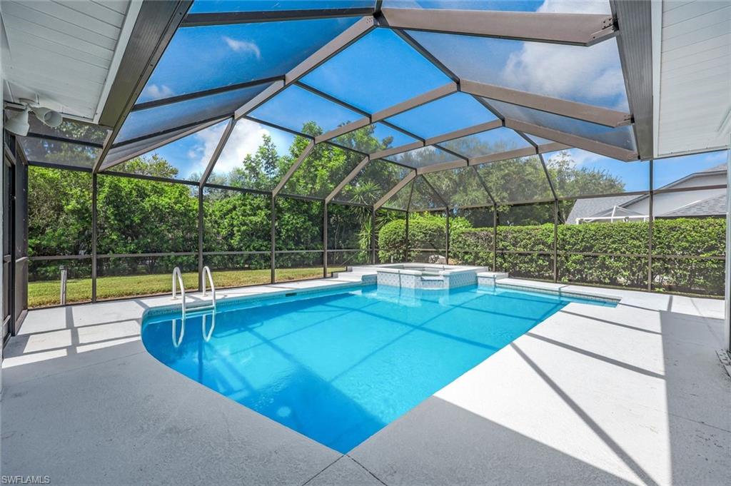 a view of a backyard with swimming pool