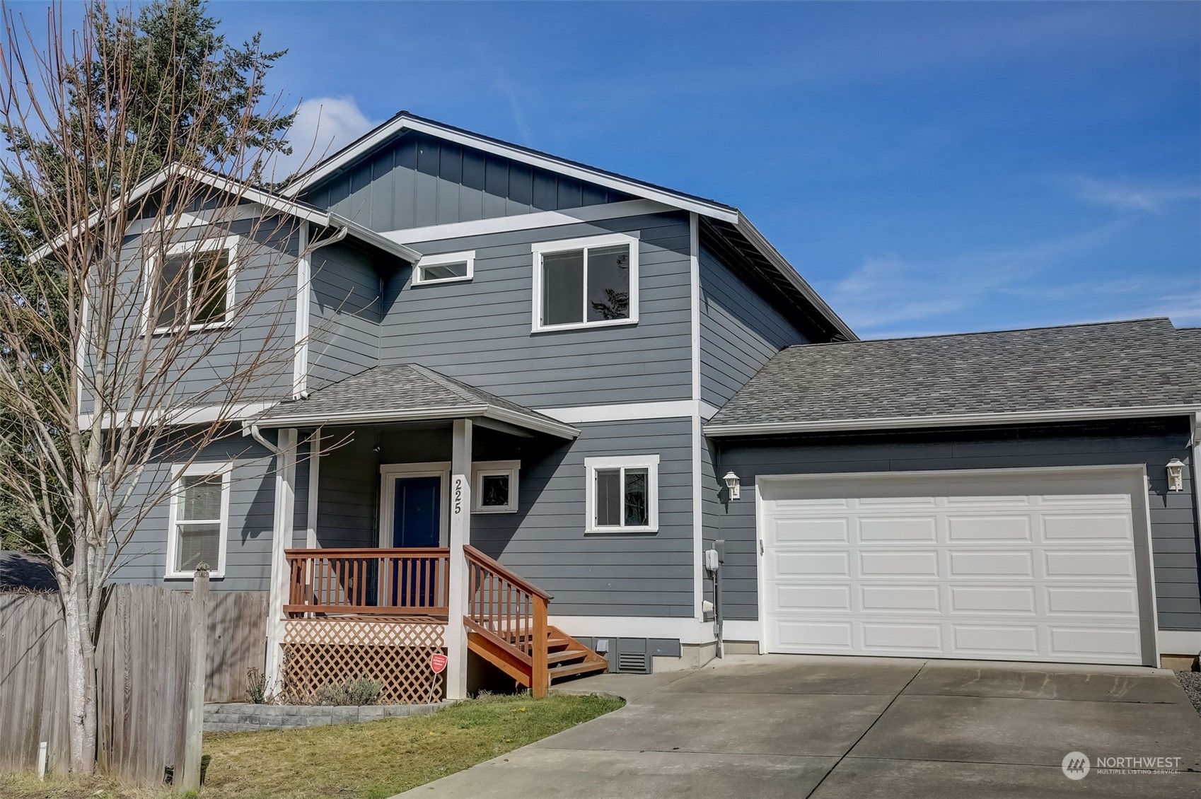 a front view of a house with a garage