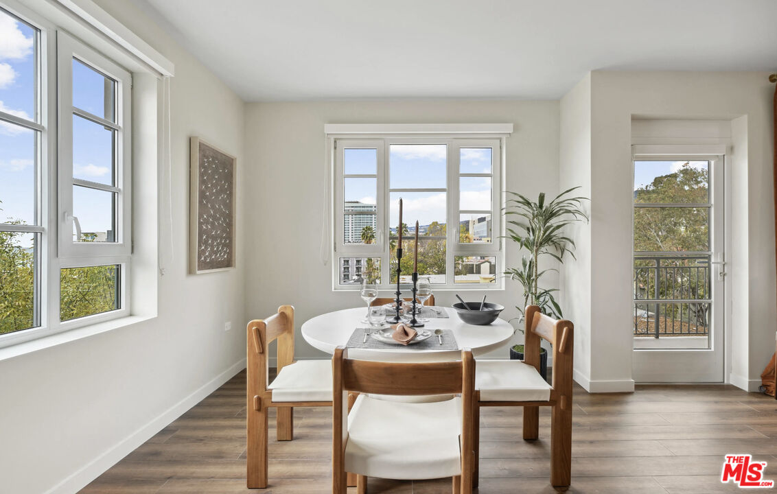 a dining room with furniture window wooden floor