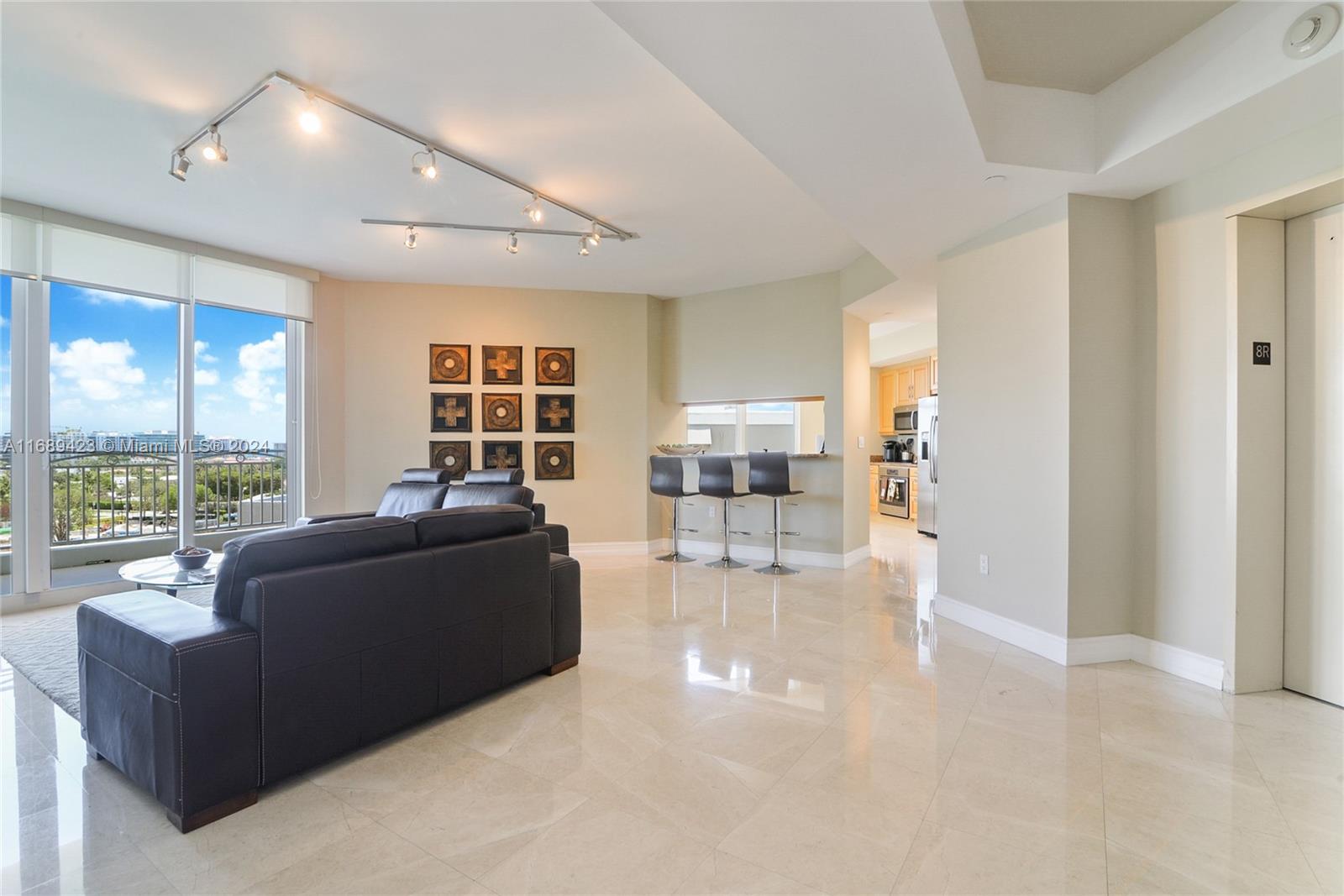 a living room with furniture and a window