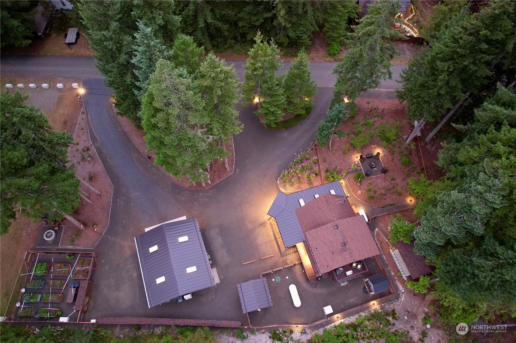 an aerial view of a house with yard