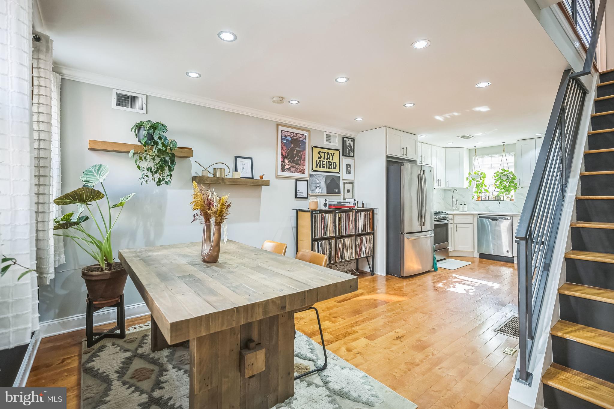 a view of kitchen with furniture and wooden floor