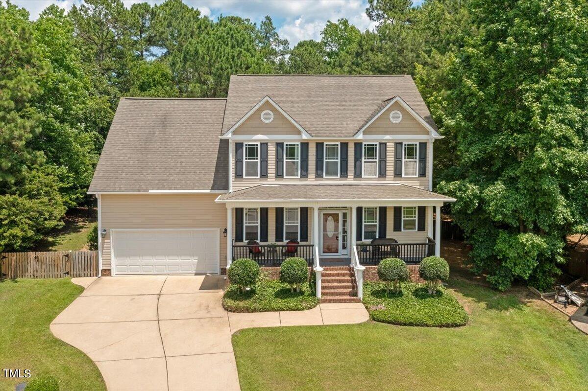 a aerial view of a house with a yard