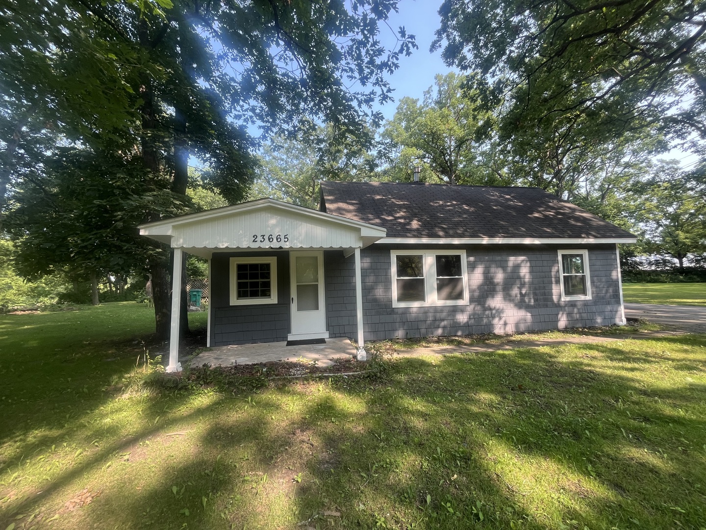 front view of a house with a yard