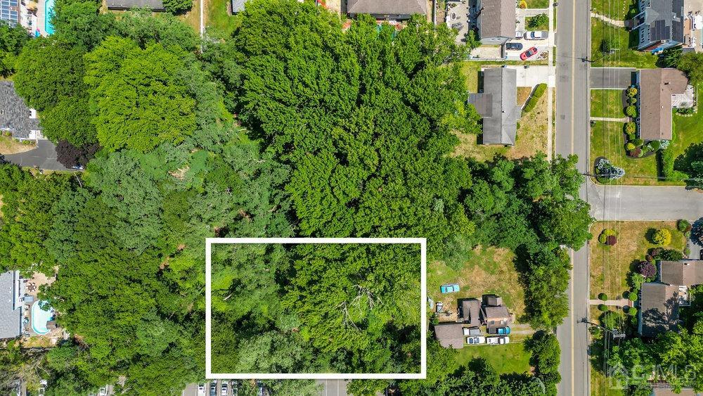 an aerial view of a house with yard