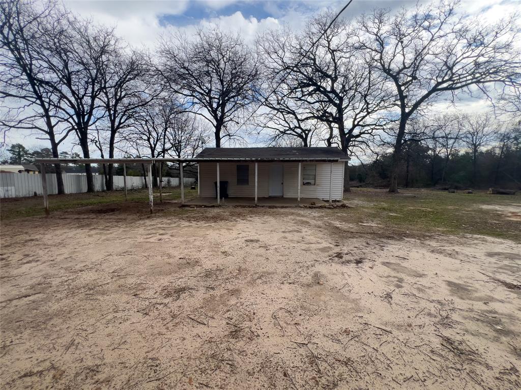 a view of house with a yard