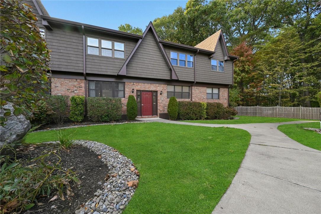 View of front of property with a front yard