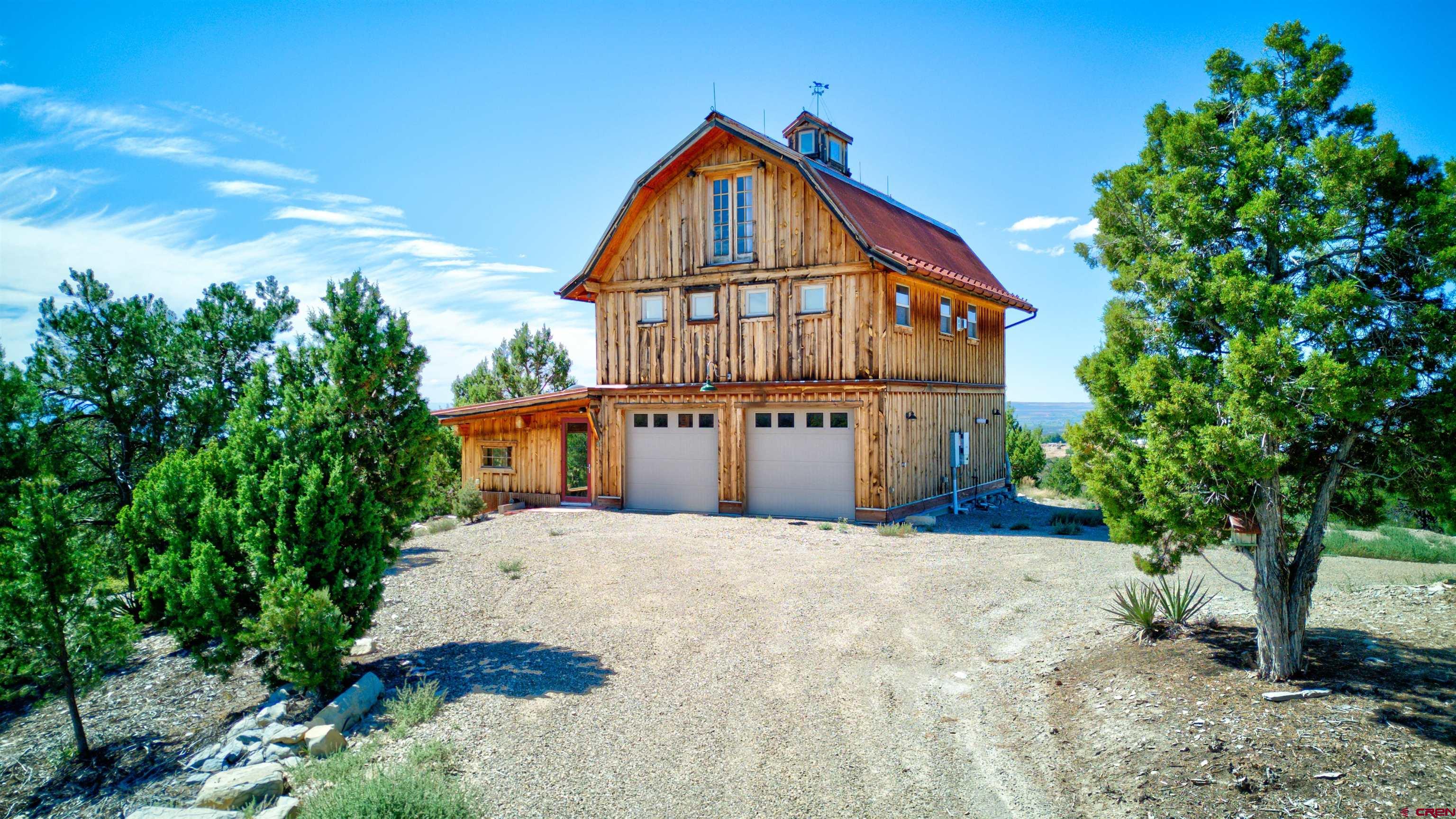 a view of front of house with a yard