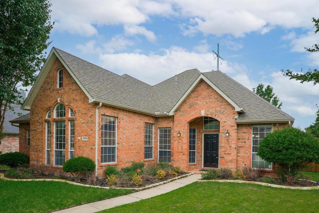 front view of a house with a yard