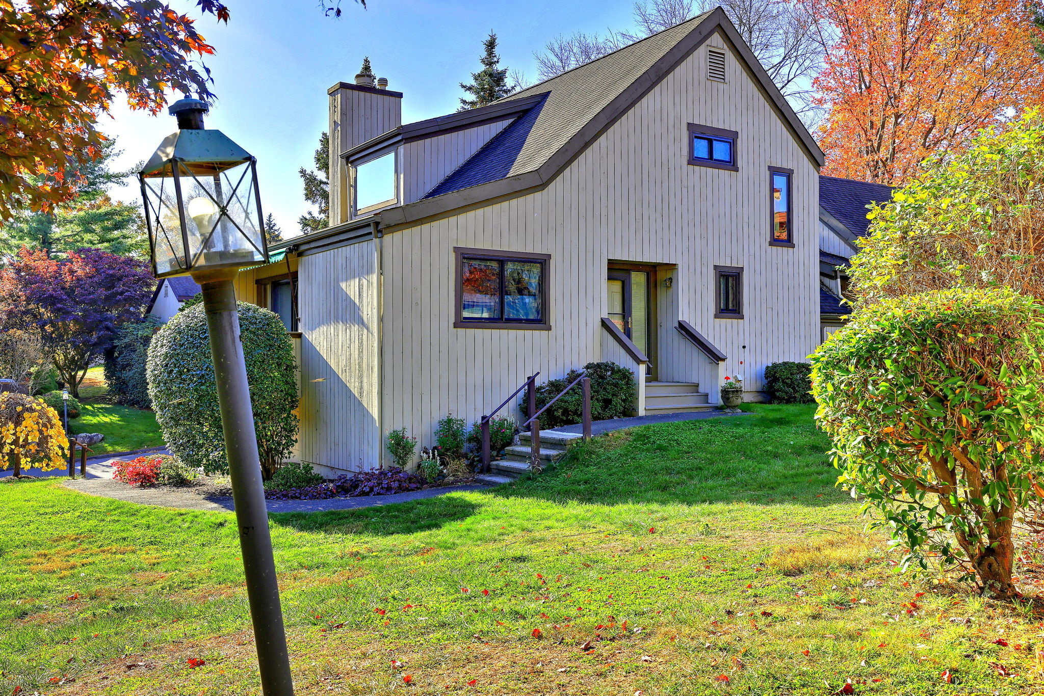 a front view of a house with garden