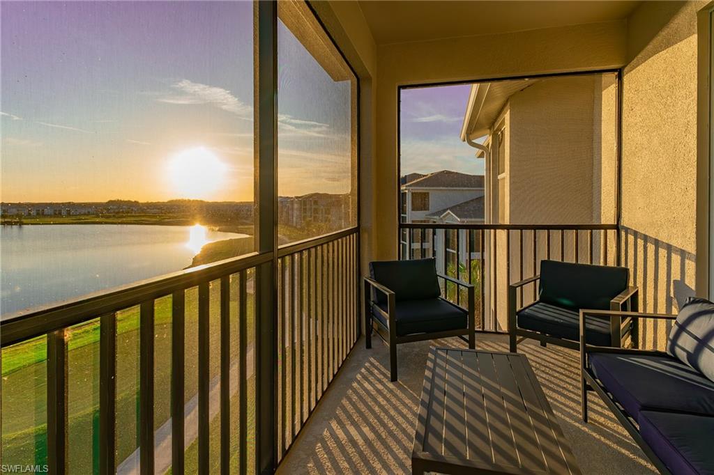 a view of a balcony with chair and wooden floor