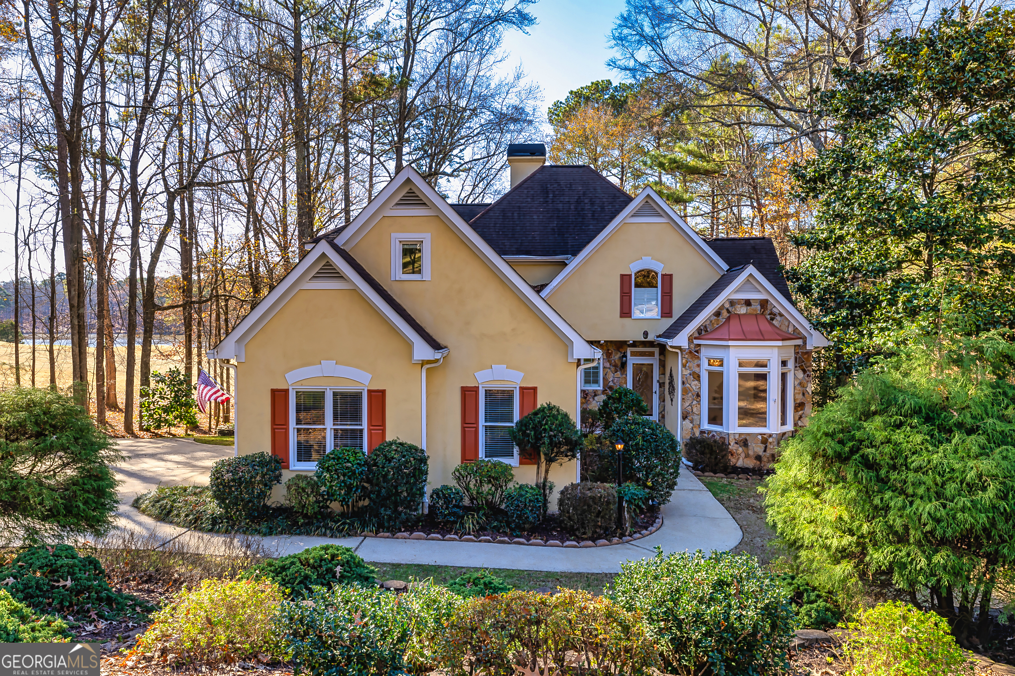 a front view of house with yard and green space