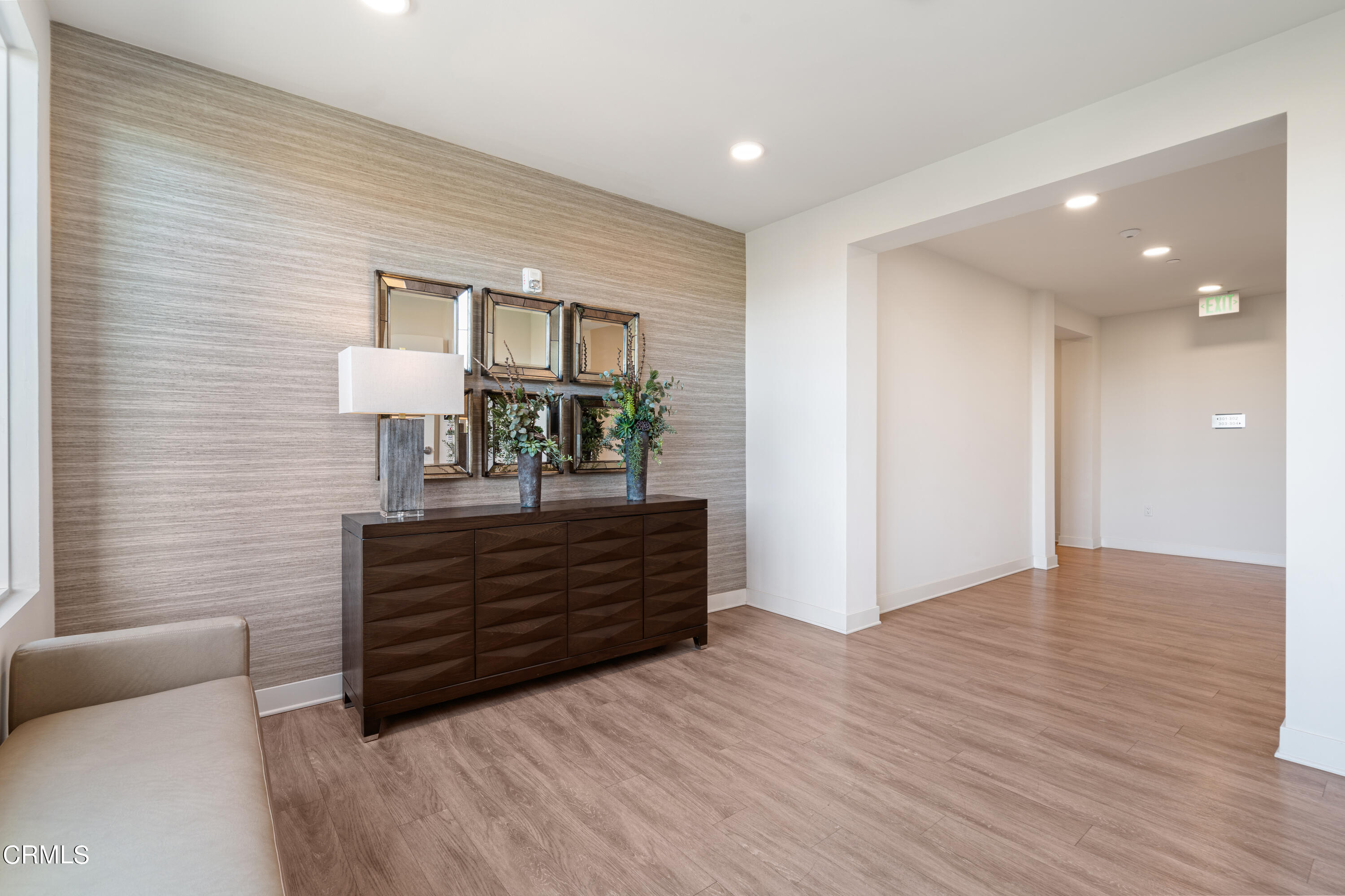 a room with furniture and wooden floor