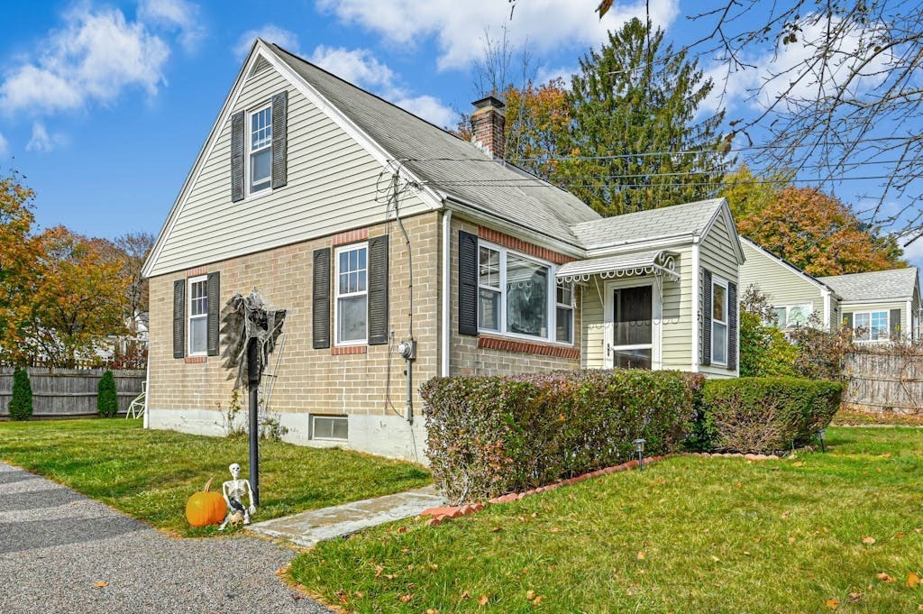 a front view of a house with garden