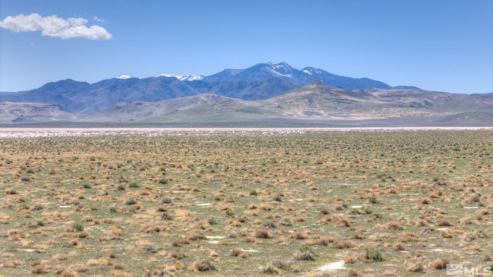 a view of ocean with mountains in the background