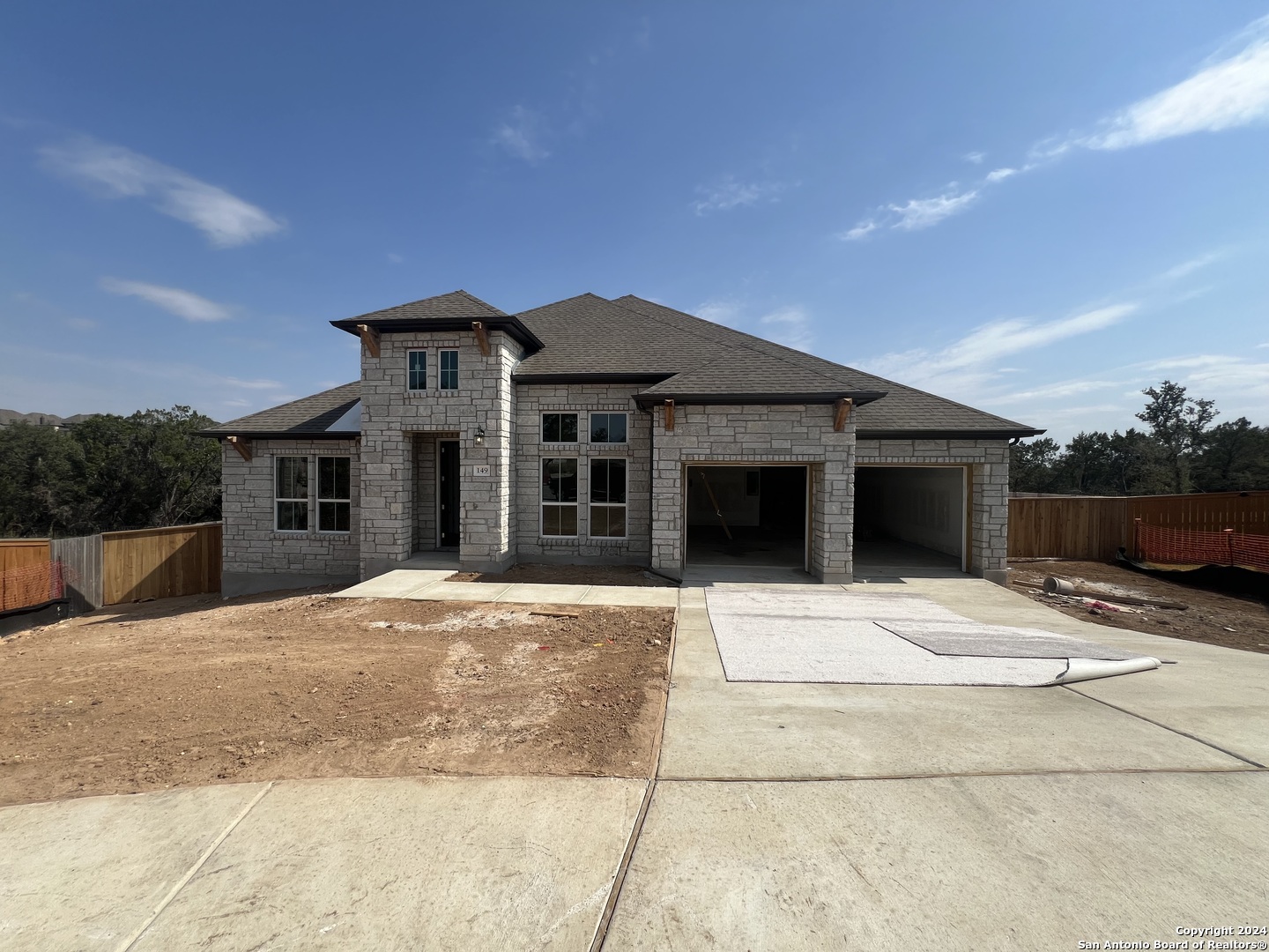 a front view of a house with a garage