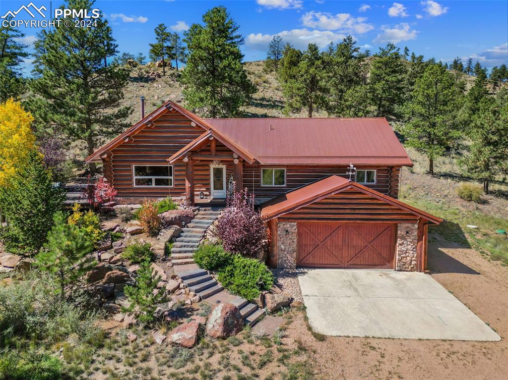 Log home with attached 2 car garage