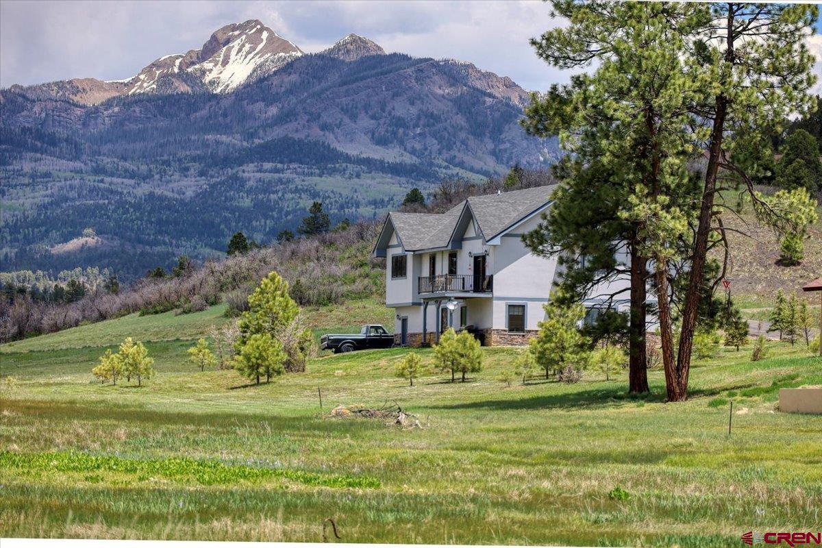 a view of a house with a big yard