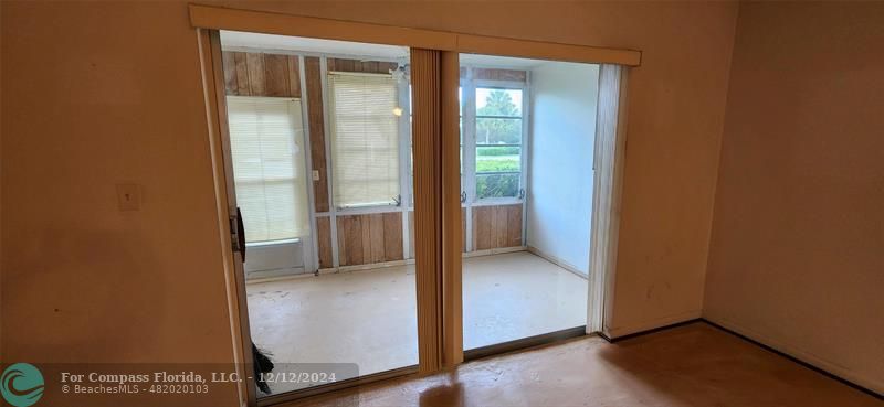 an empty room with wooden door