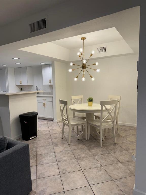 a dining room with a table and chairs in it