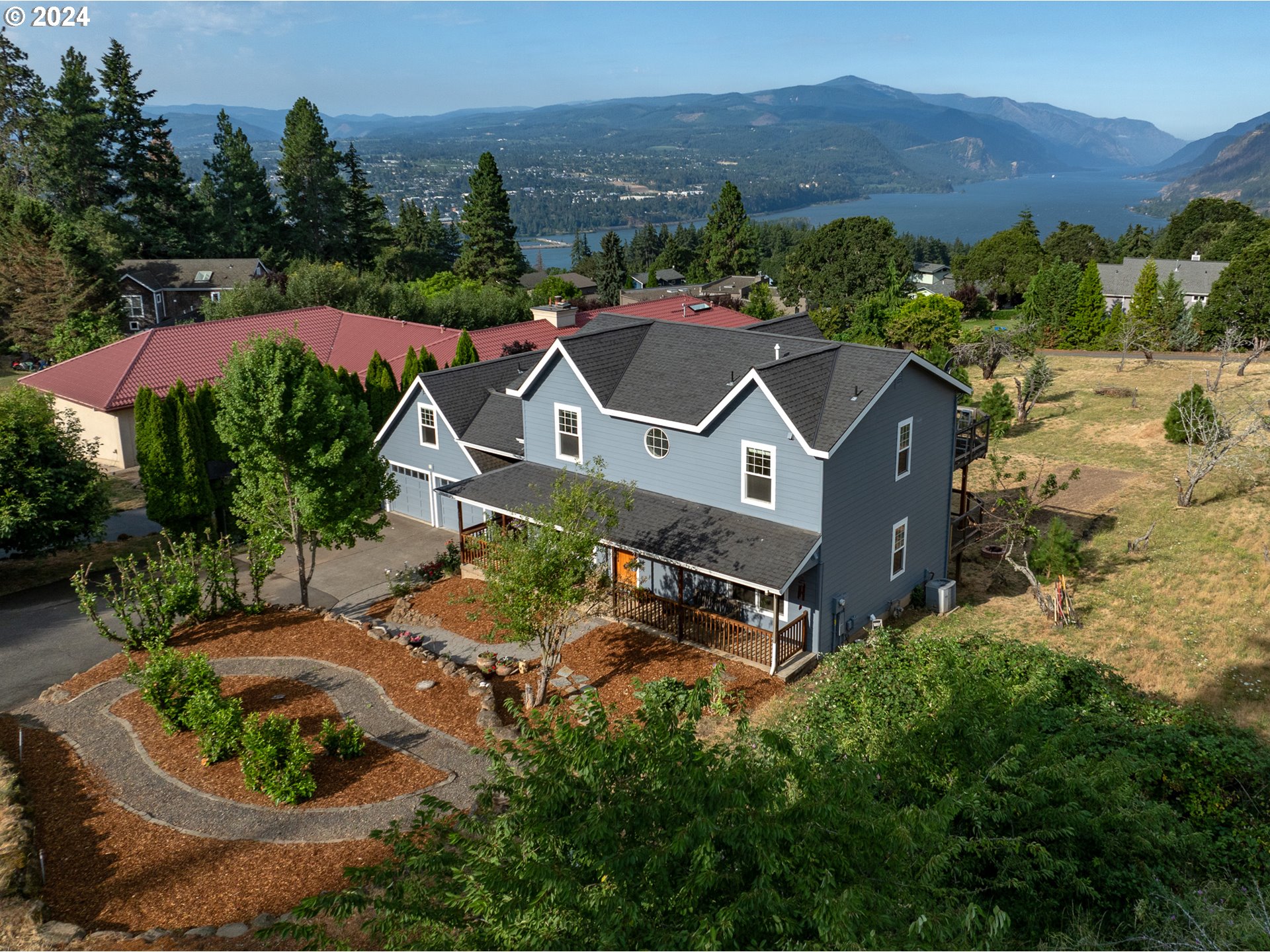 an aerial view of a house with a garden