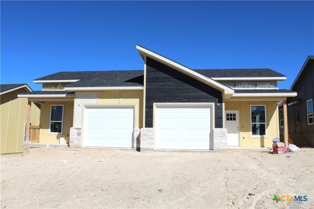 a front view of a house with a outdoor space