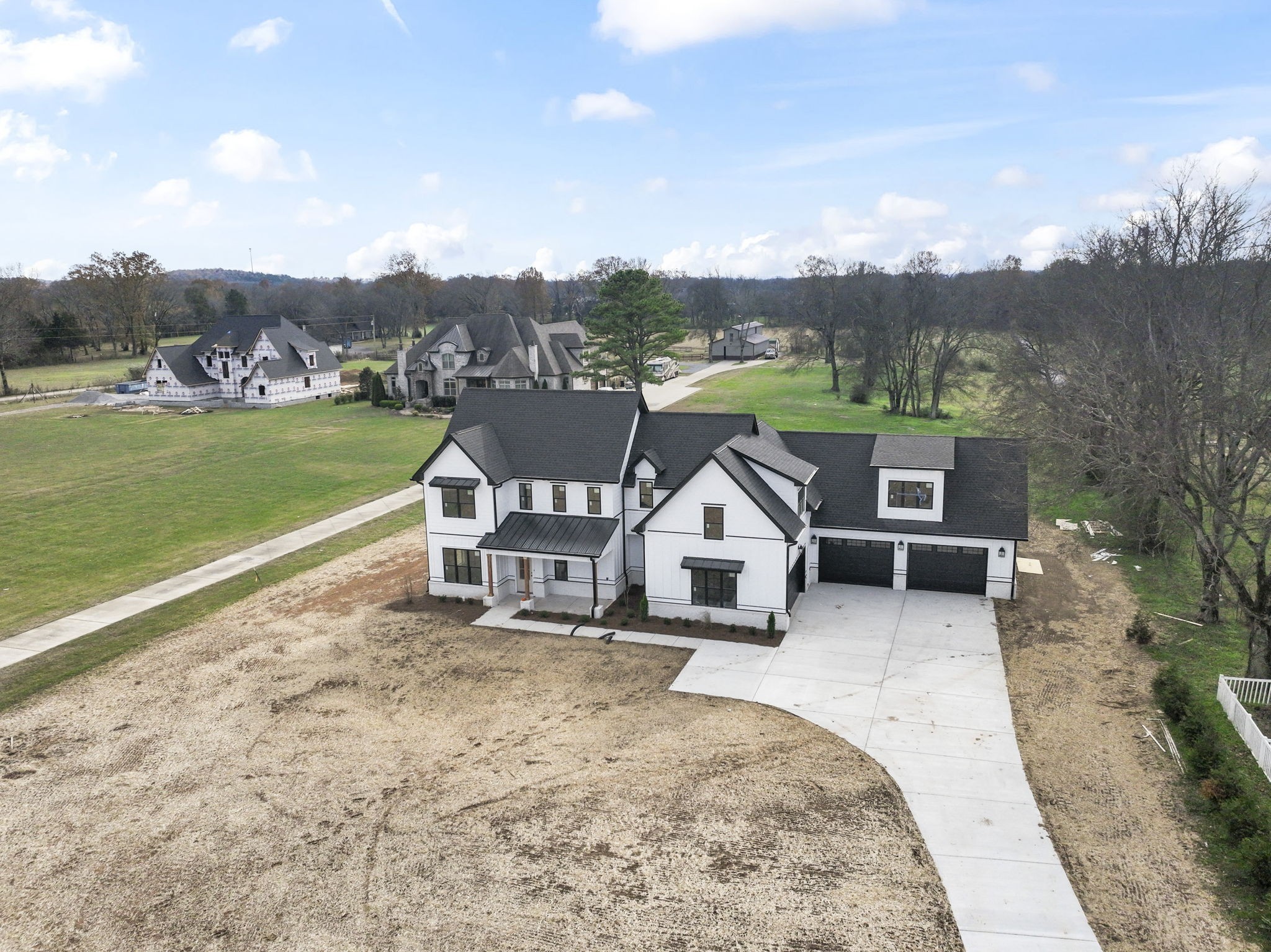 a view of a house with a yard and sitting area