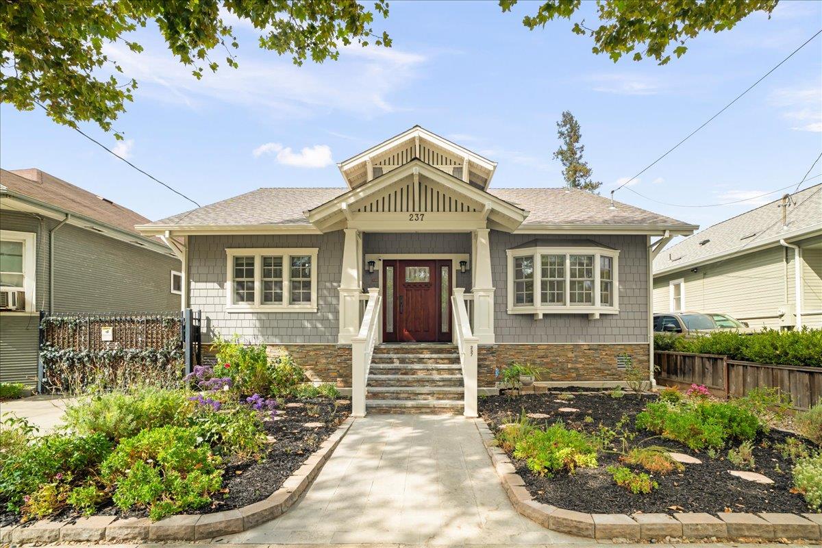 a front view of a house with garden