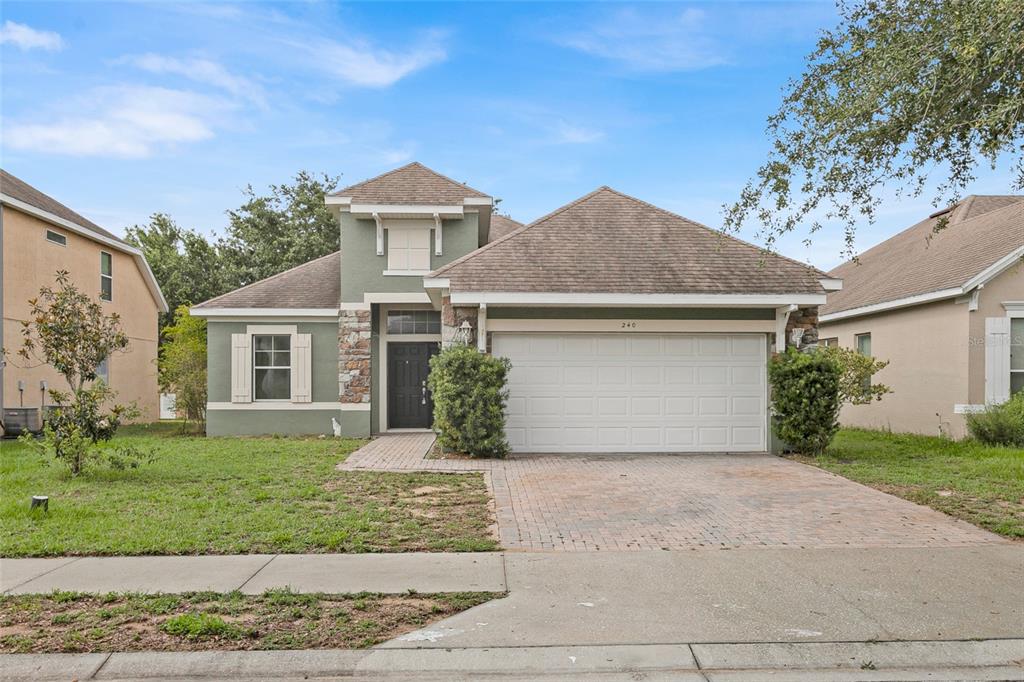 front view of a house with a yard