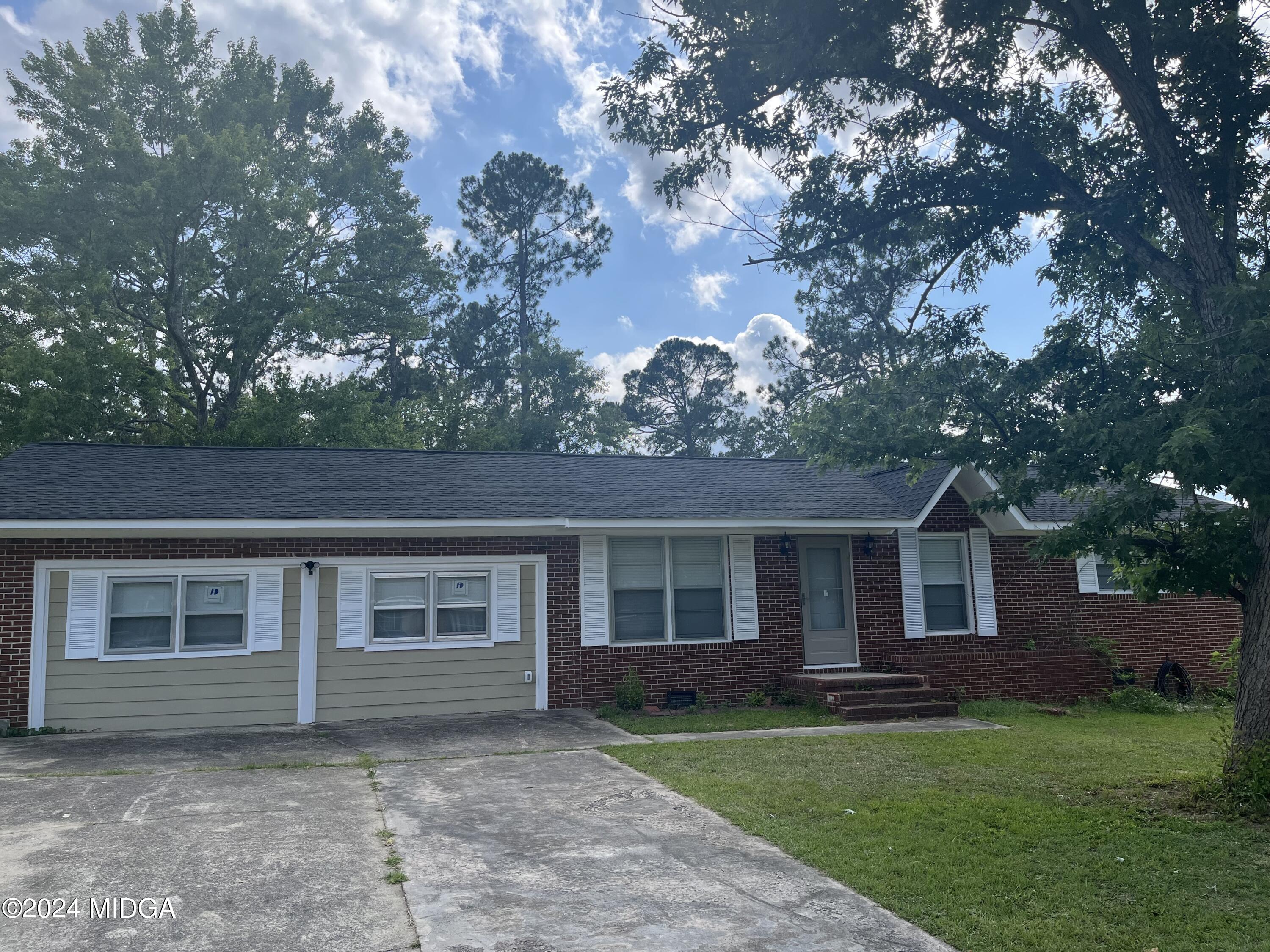 front view of a house and a yard