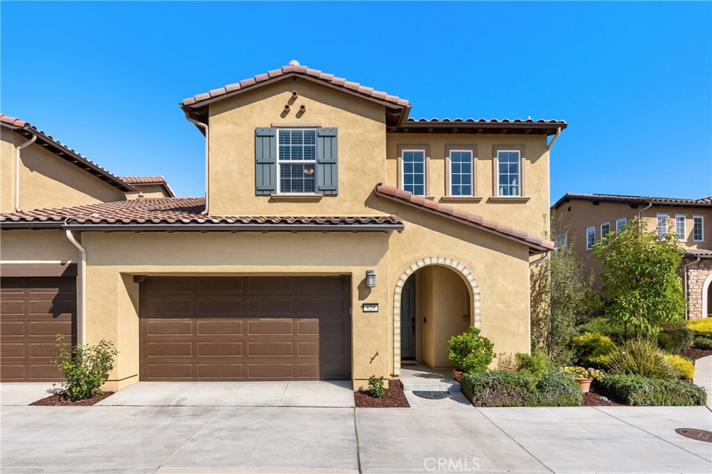 a front view of a house with garage