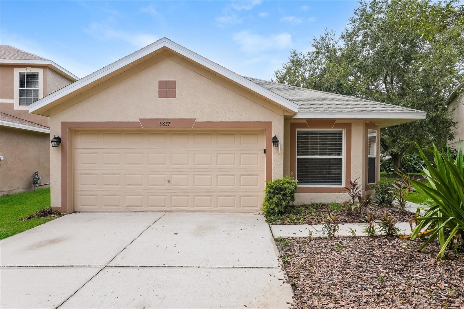 a front view of a house with a garage