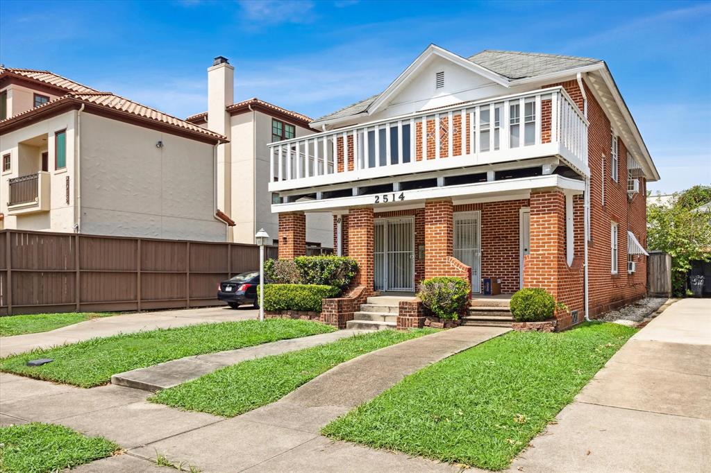 a front view of a house with garden and porch