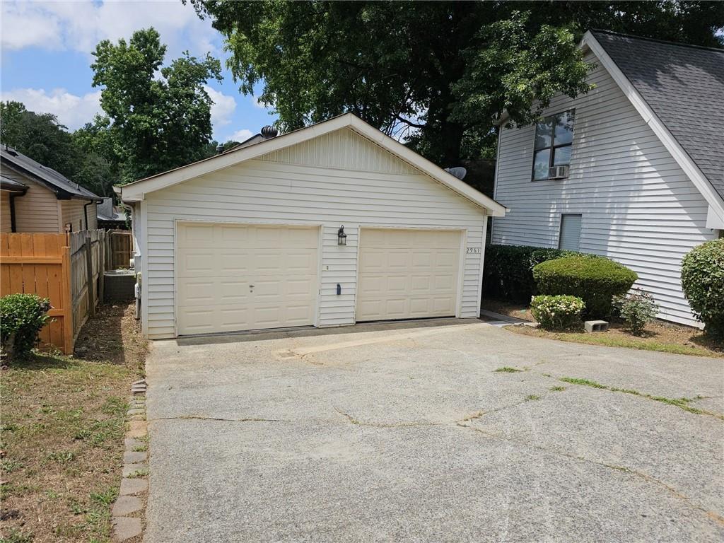 a view of garage and yard