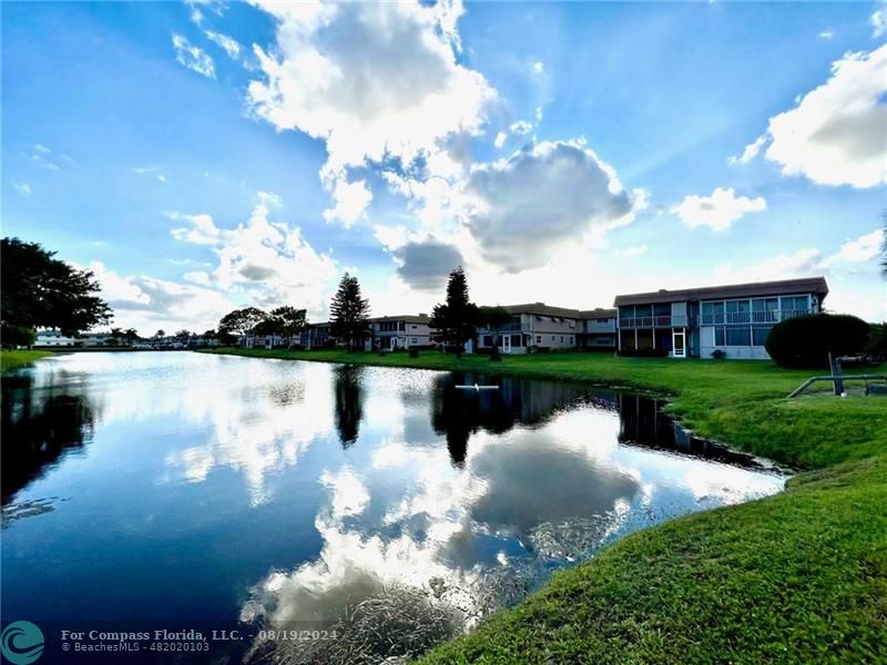 a view of a lake with a garden