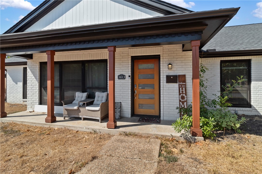 a view of a front door and a chair