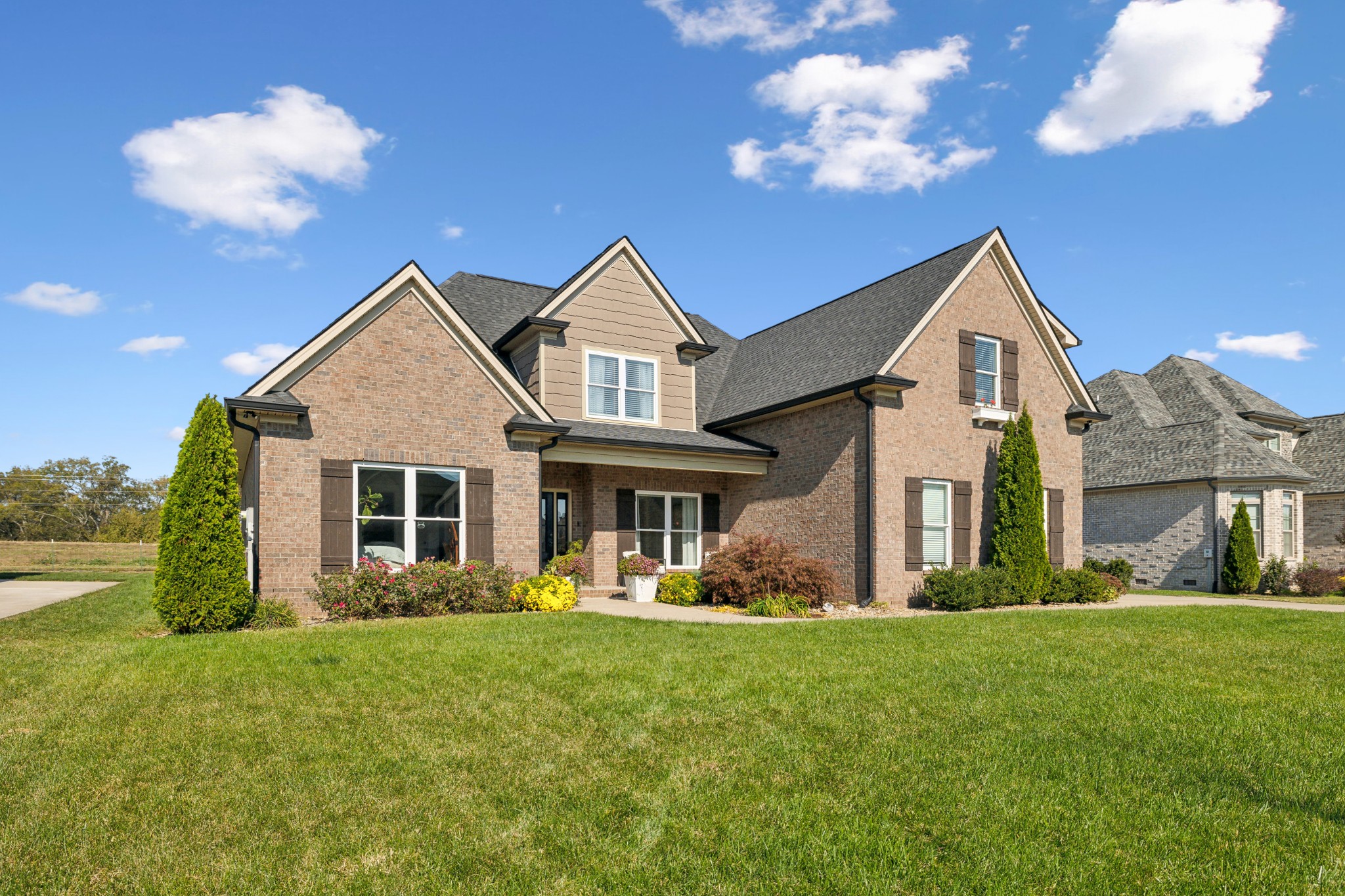 a front view of a house with a yard