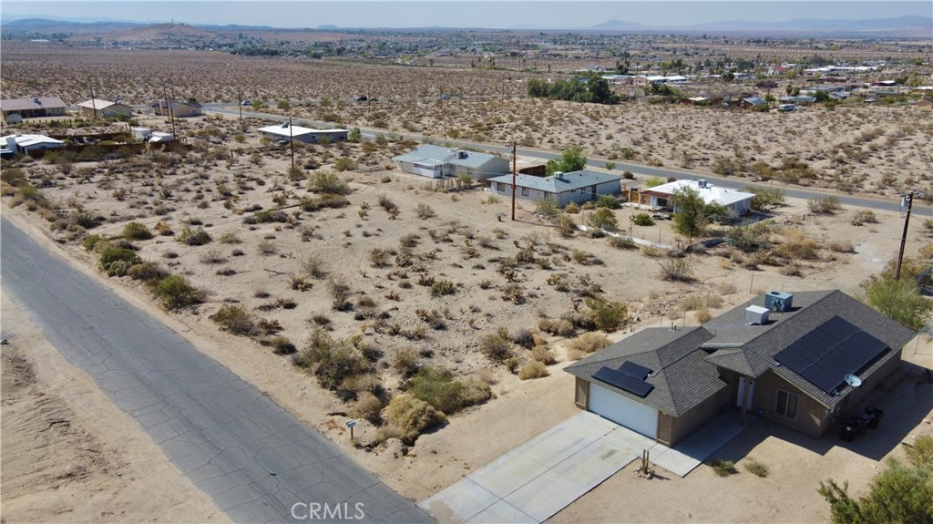 an aerial view of house with yard