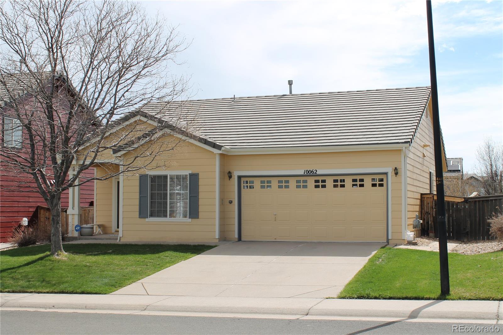 front view of a house with a garden