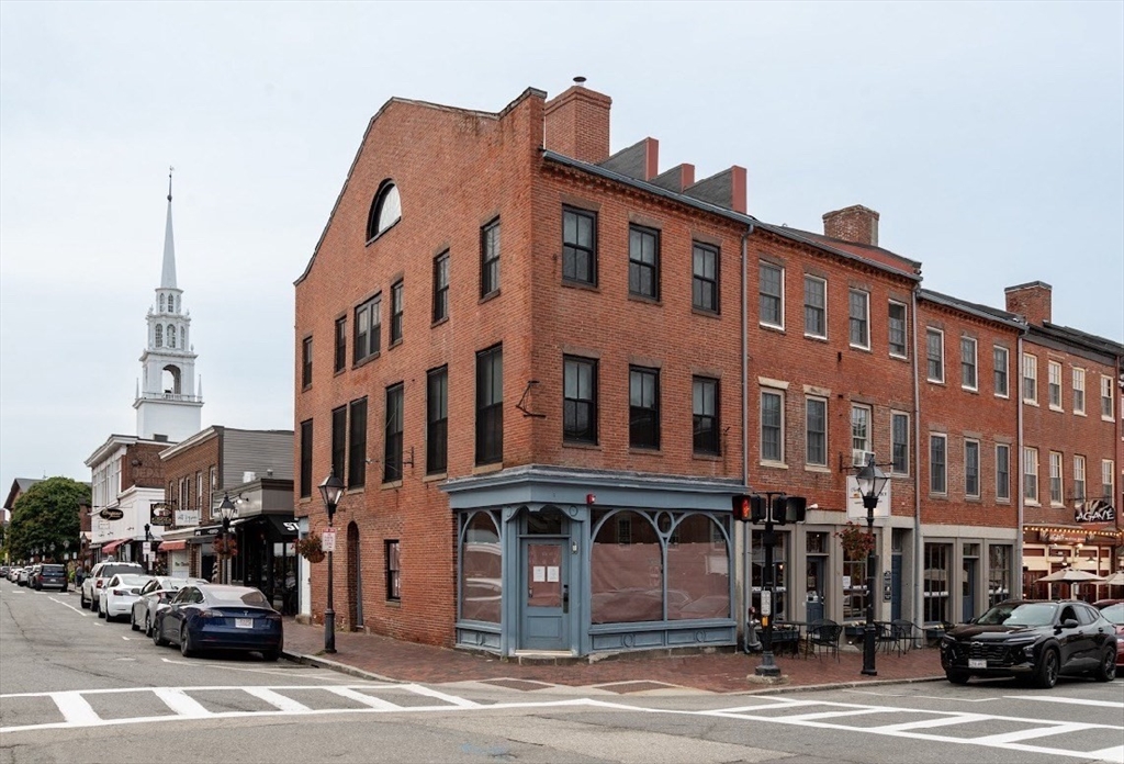 a front view of a building with a street