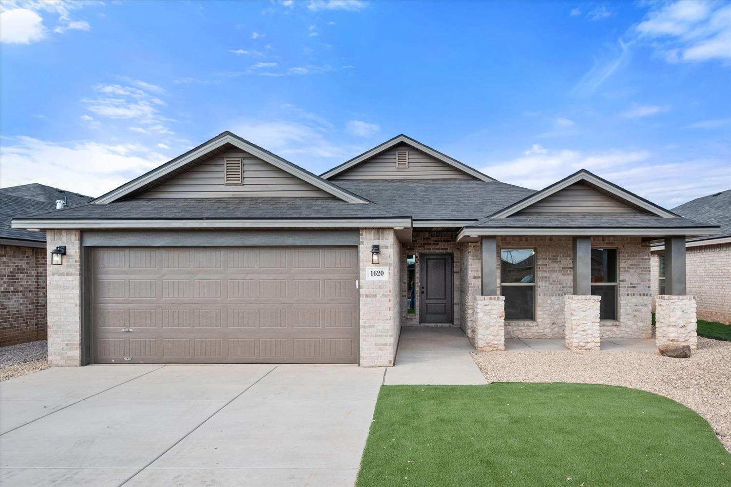 front view of a house with a yard