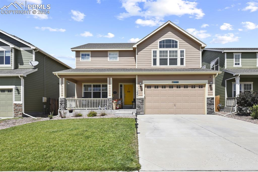 front view of a house with a yard