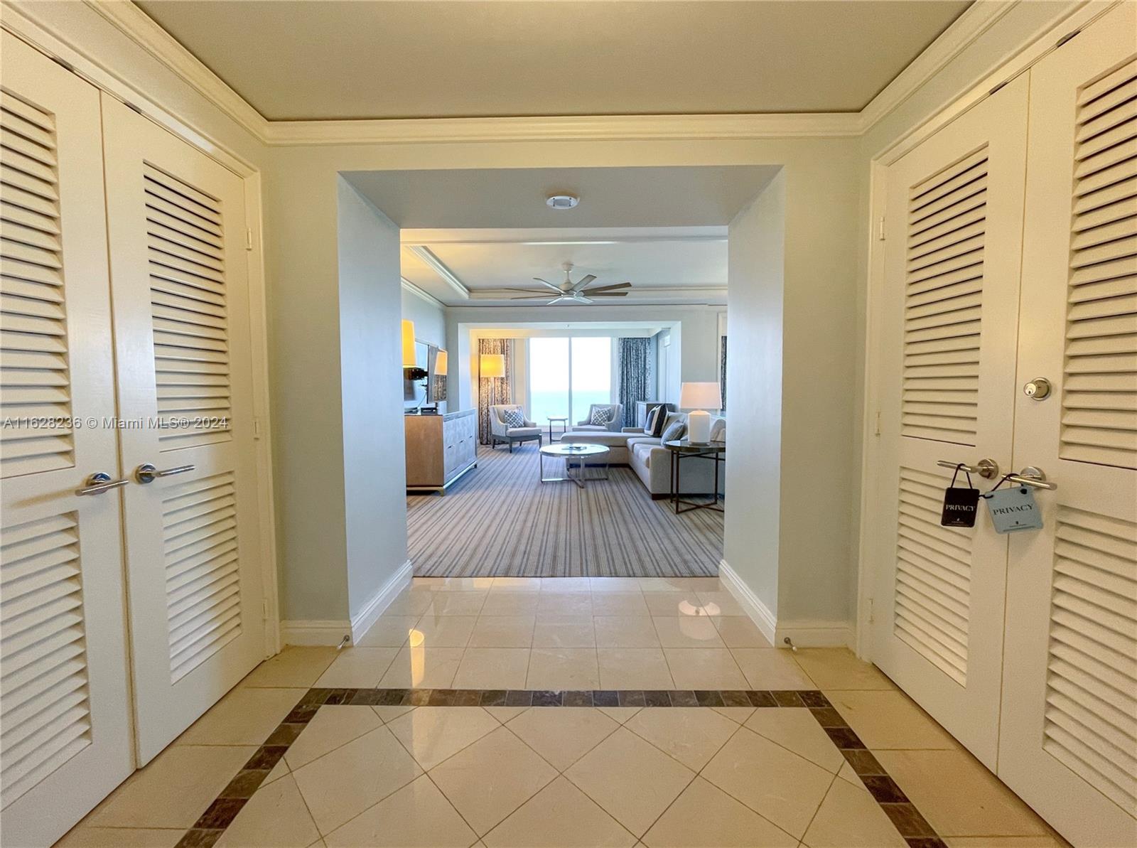 a en suite bathroom with a sink and glass door shower