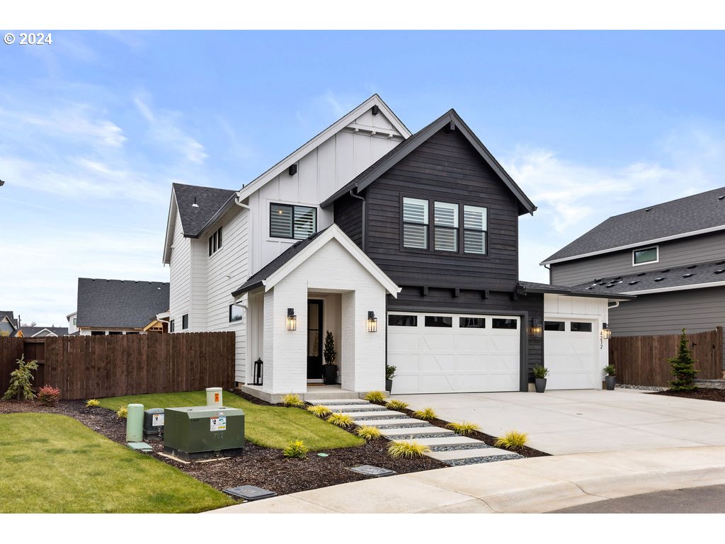 a view of a house and a yard